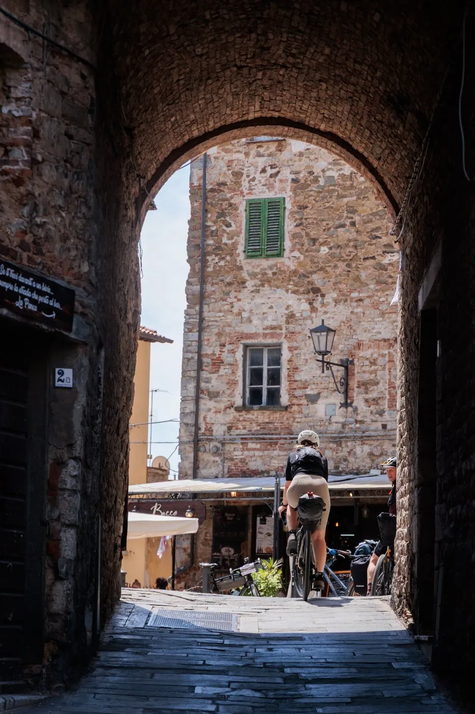 Looking through a medieval archway in the old town of Campiglia Marittima