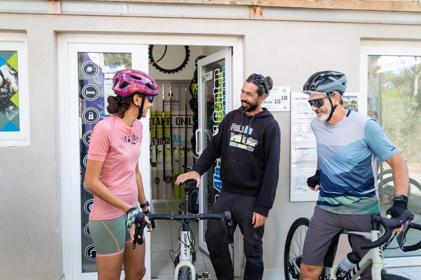 Riders with their bikes outside the bike shop and rental of PuntAla Camp &amp; Resort