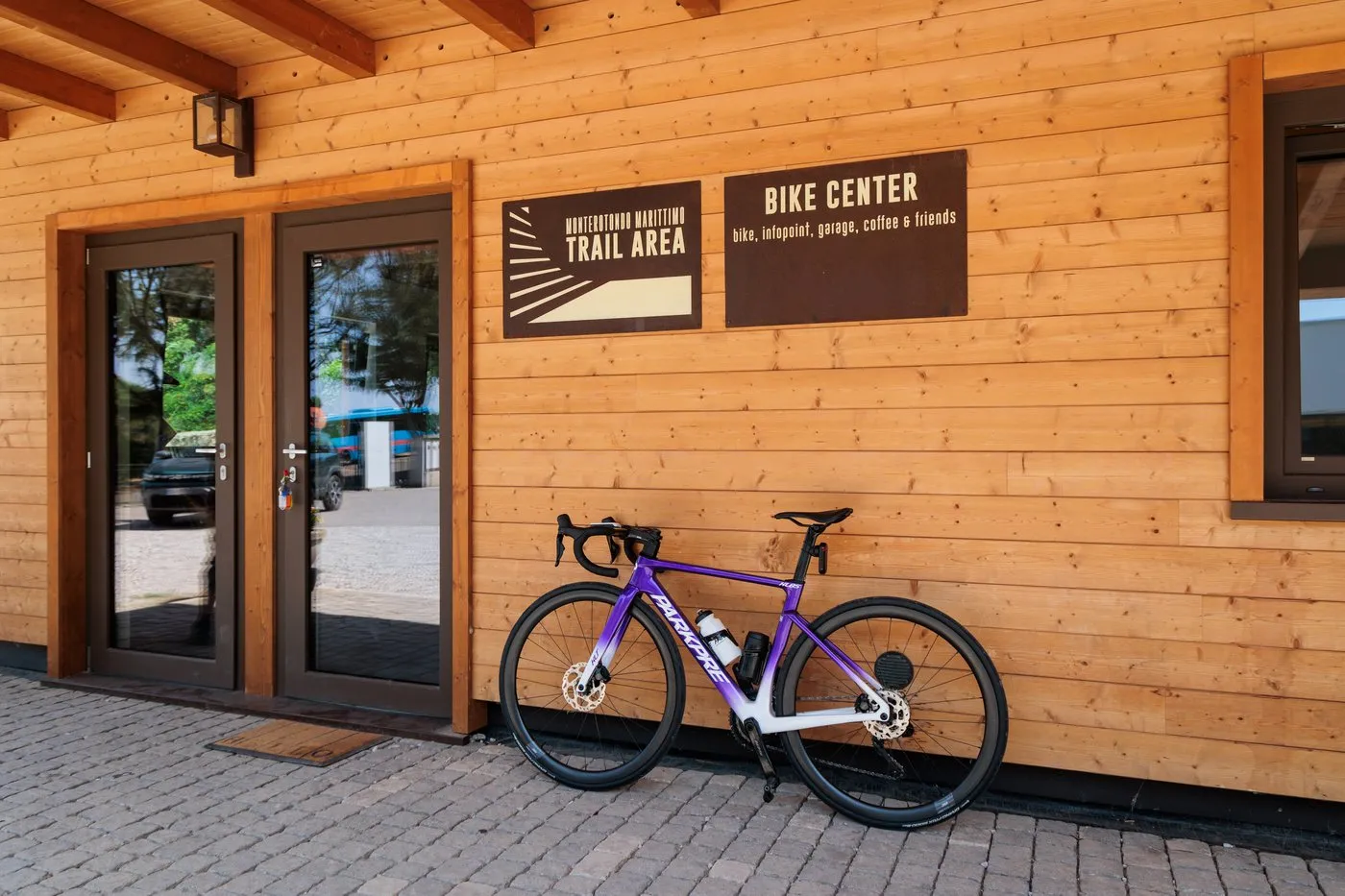 The Bike Center of the Monterotondo Marittimo trail area, with a road bike outside